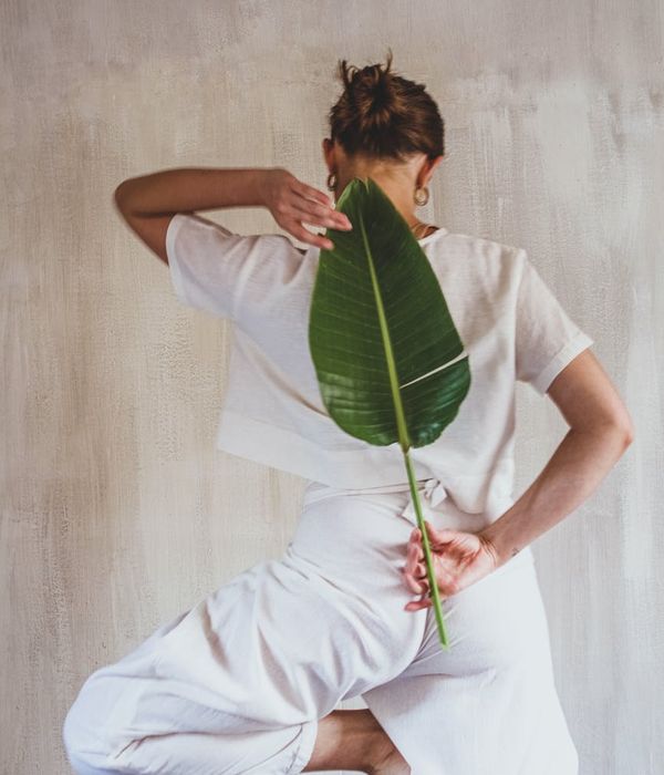Woman holding a graceful yoga posture with abstract digital lines